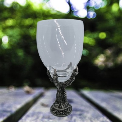 Glass chalice with foot of pewter eagle claw