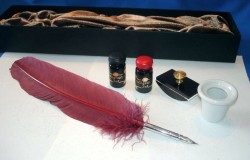 Caligraphy set with turkey feather, 2 x ink, inkpot and blotting cradle